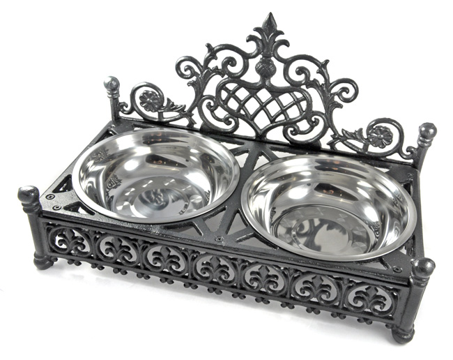 Large decorative cast iron dog and cat bowl £45. 00