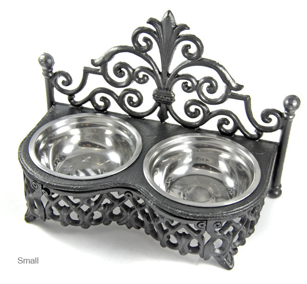 Small decorative cast iron dog and cat bowl £29. 00