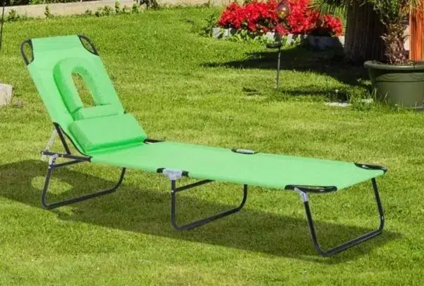 Green sun lounger with reading hole & pillow