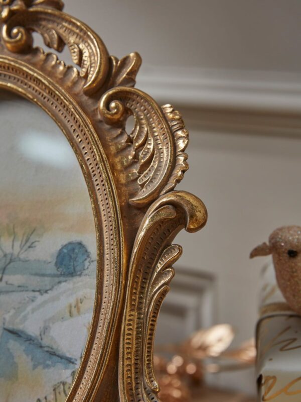 Golden ornate photo frame