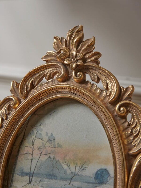 Golden ornate photo frame