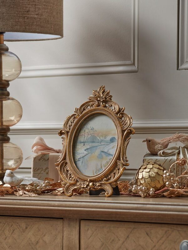 Golden ornate photo frame