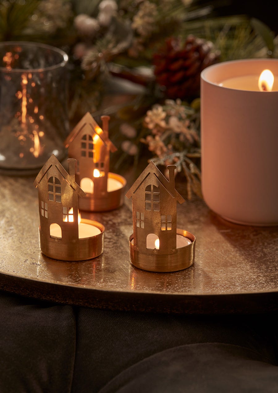 Three brass house tealight holders Three brass house tealight holders
