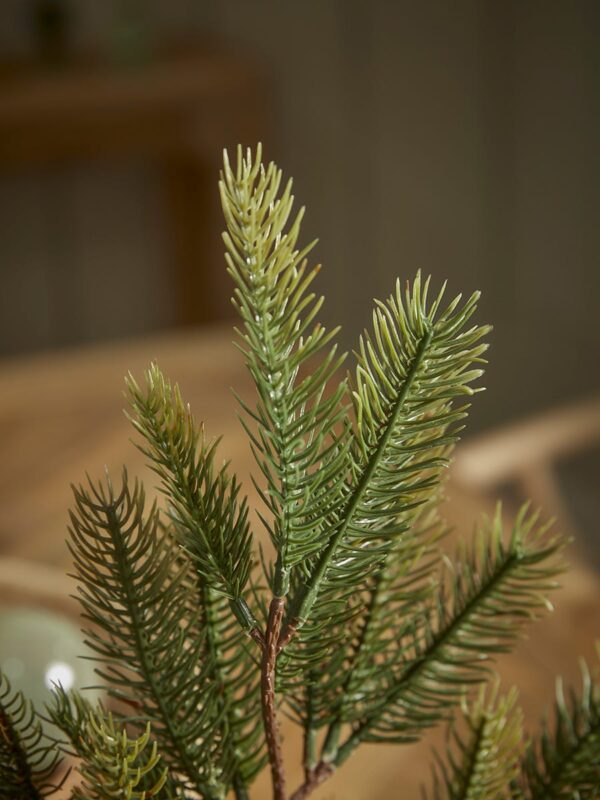 Three faux pine stems