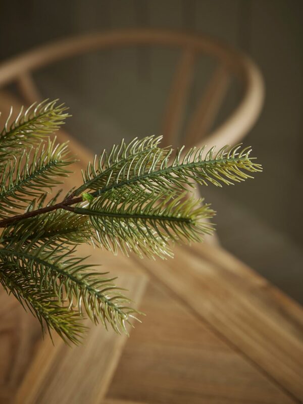 Three faux pine stems