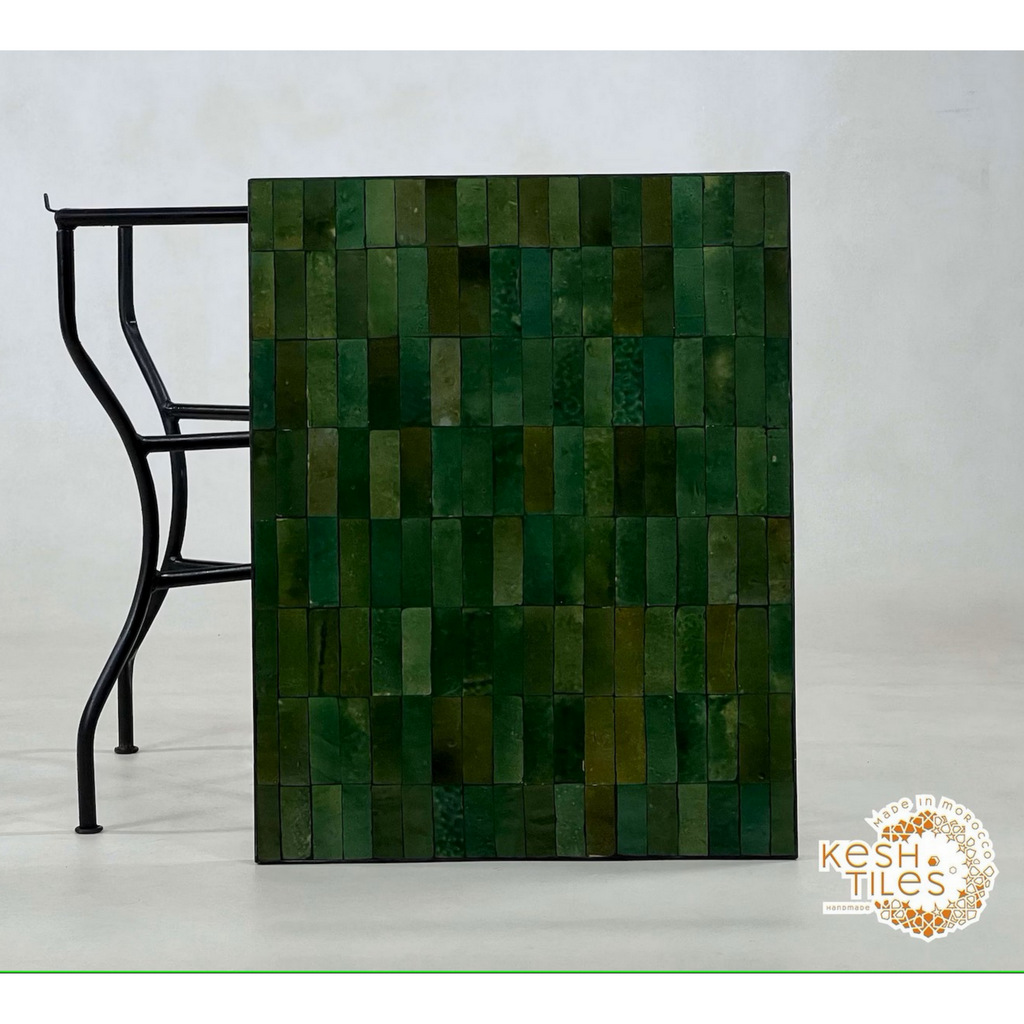 Handmade green mosaic table, customizable A railing with leaves cut out on it
